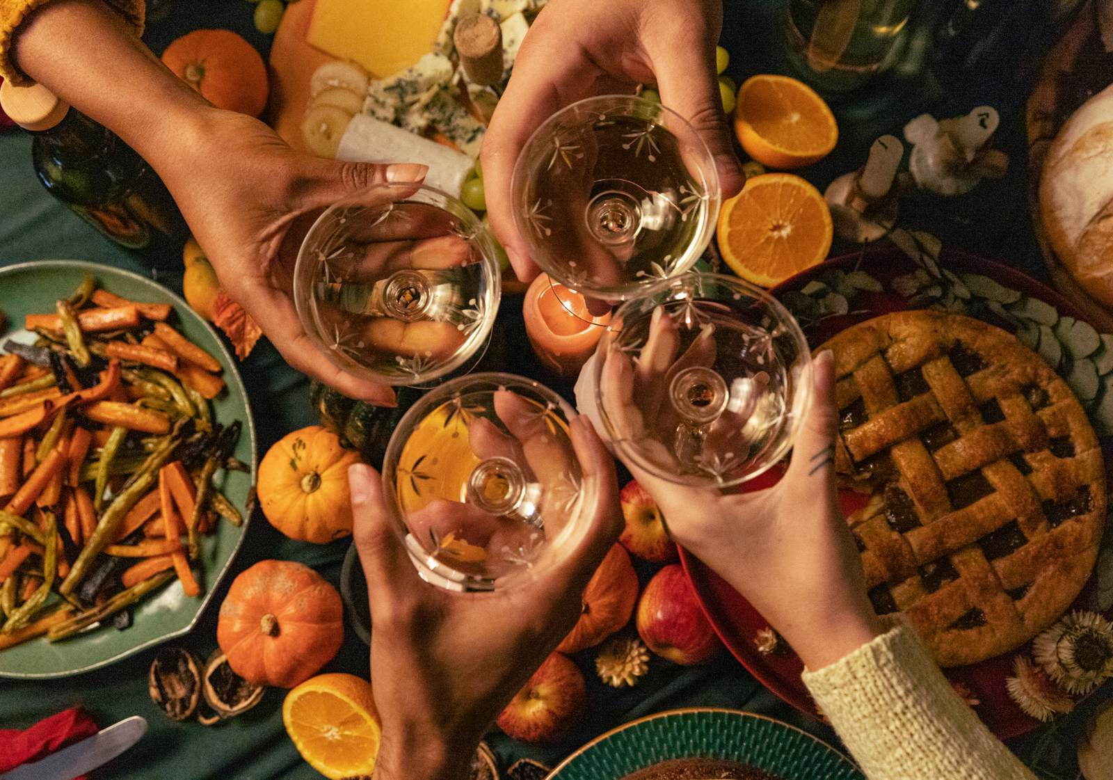 Thanksgiving 2026 in Canada: friends raising a toast over pie, pumpkins, and a harvest feast.