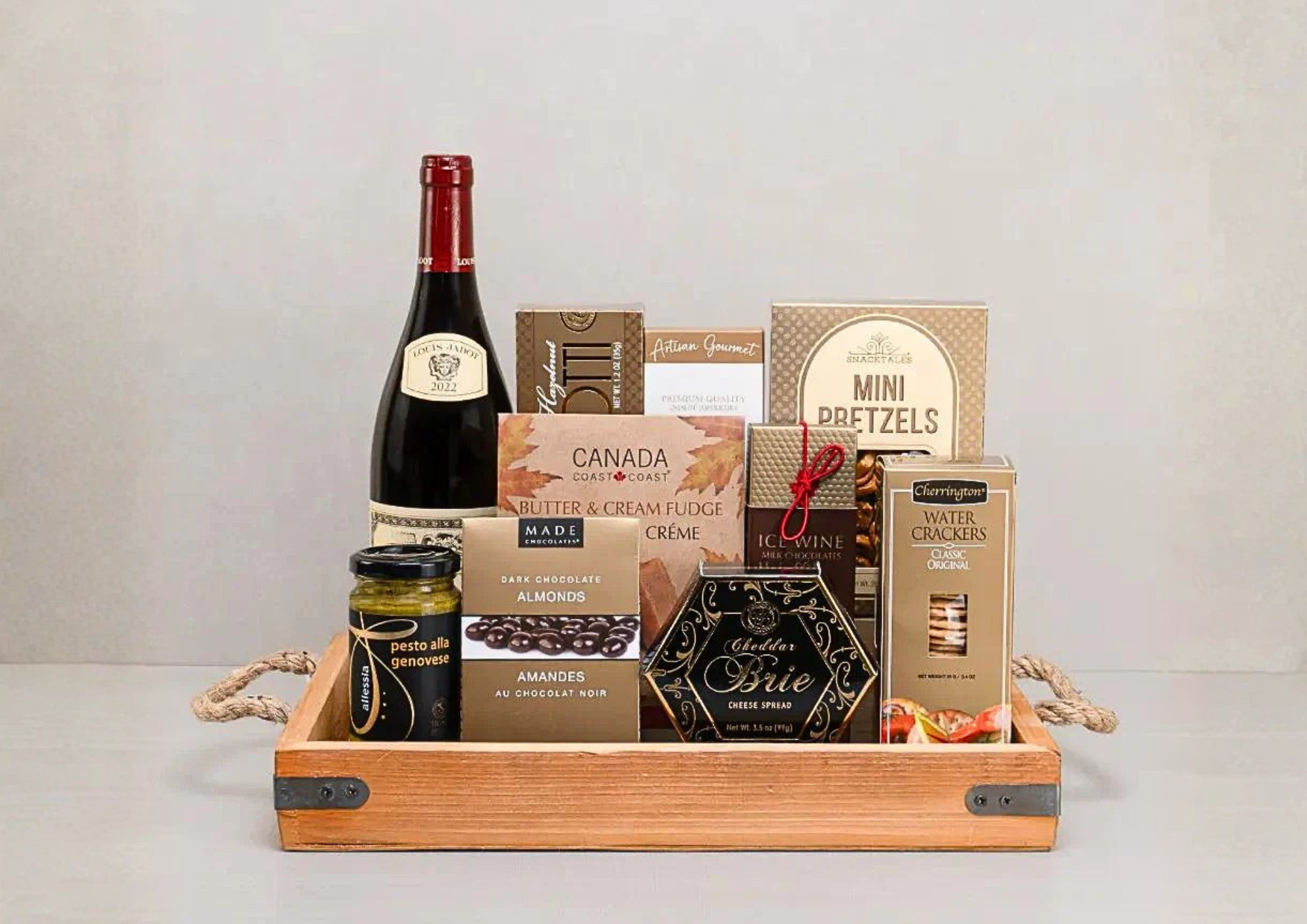 Same-day Toronto gift basket delivery featuring premium wine, artisan snacks, and chocolates in a wooden tray.
