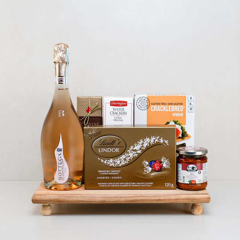 A sparkling wine and treats gift hamper for mom