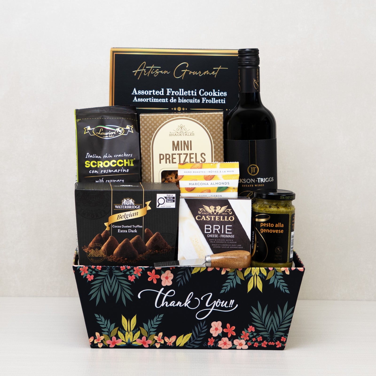 Signature Thank You Basket with red wine, brie cheese, truffles, crackers, and more in a decorative keepsake basket.