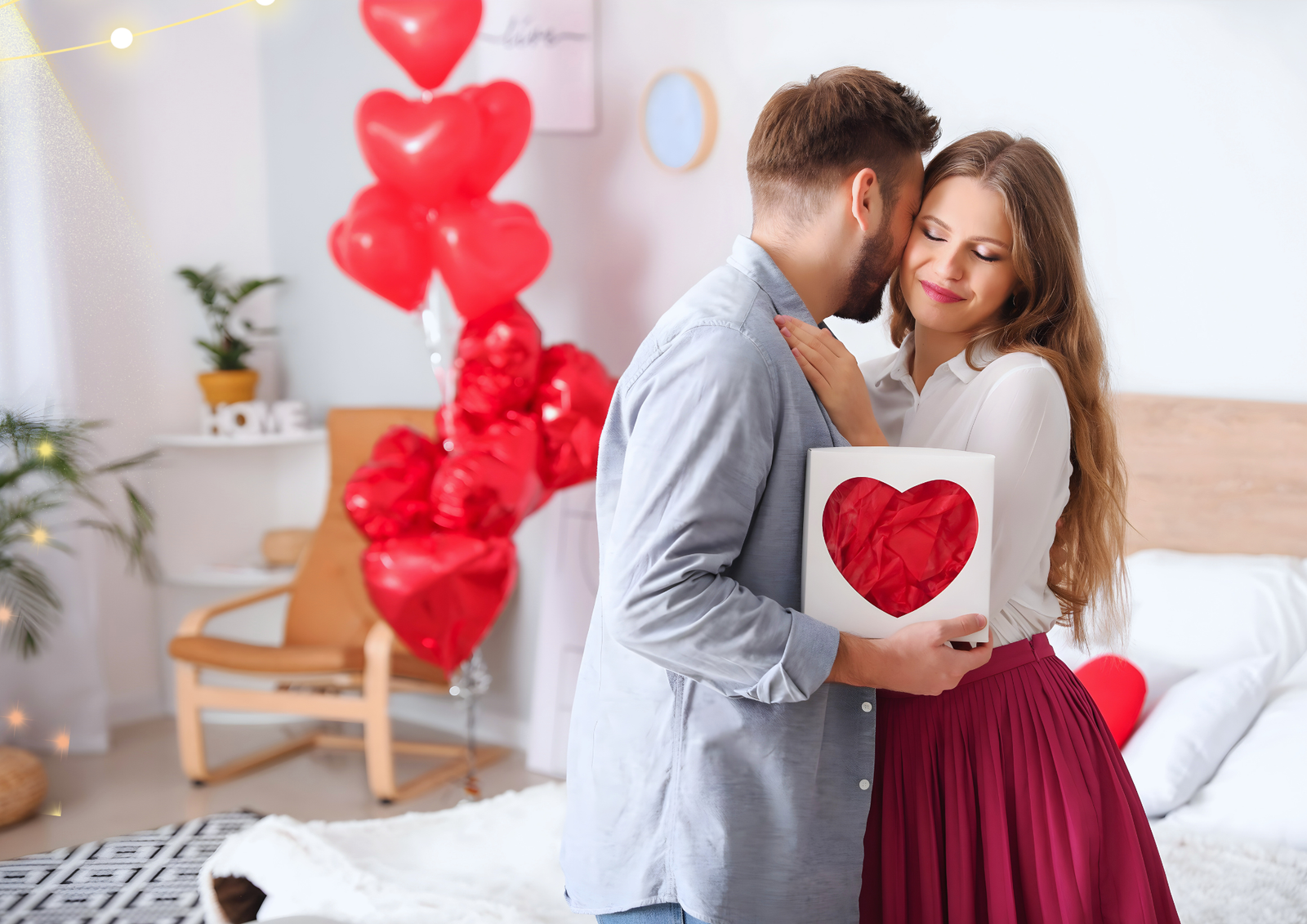 A couple celebrating Valentine's Day giving gift to each other.