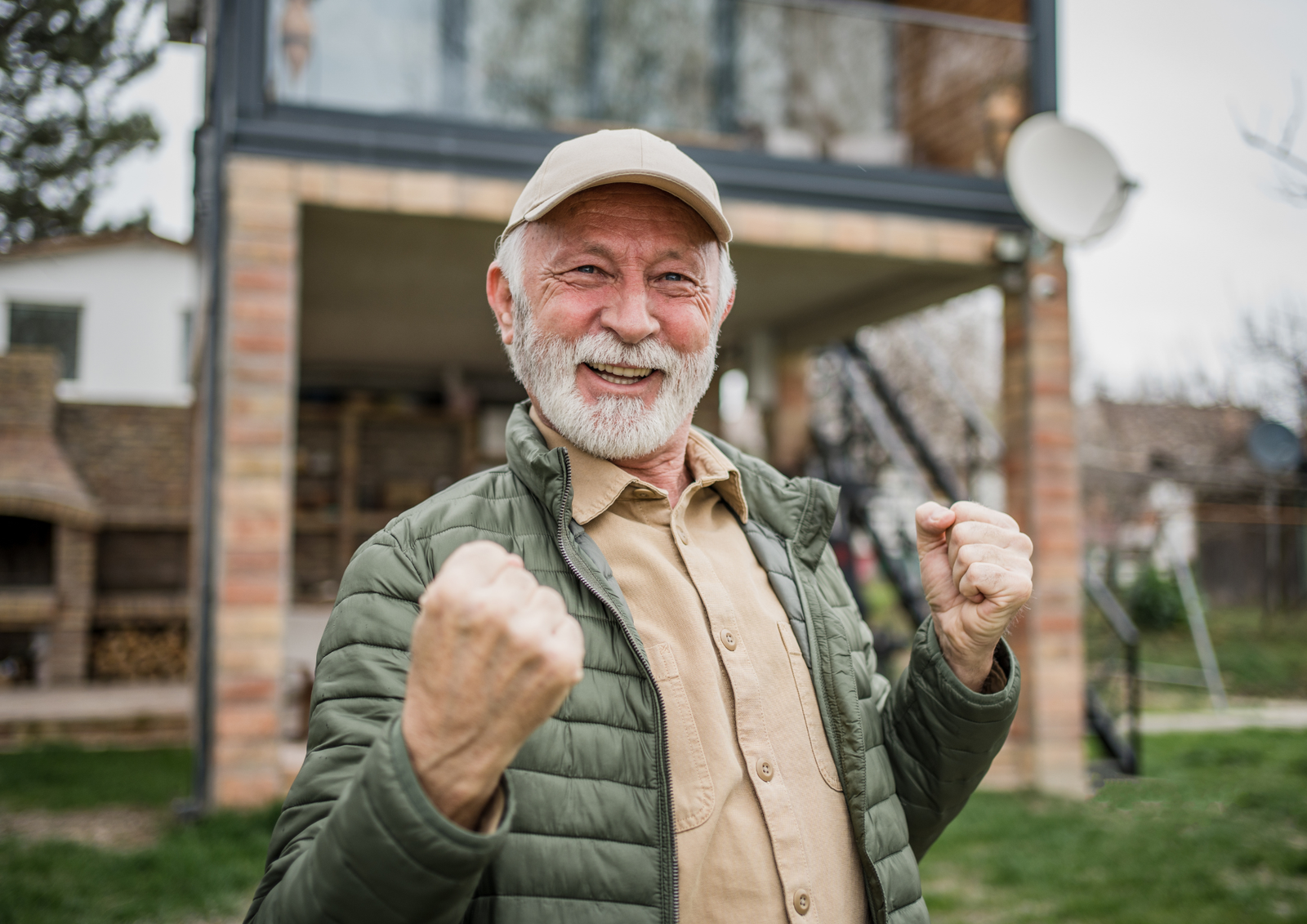 Happy retired man celebrating outdoors, representing last-minute retirement gift basket delivery in Toronto.