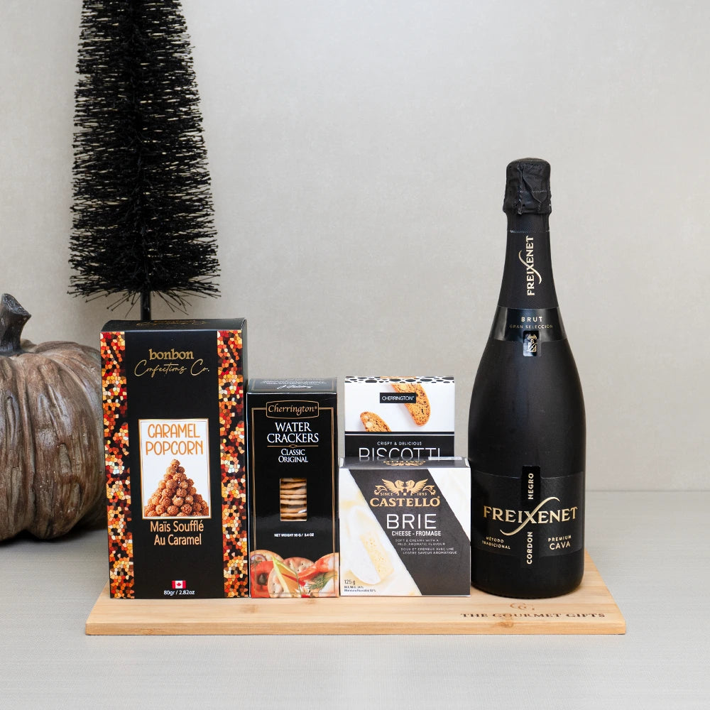 Black Cauldron Sparkle & Snacks gift basket with Freixenet Cordon Negro Cava, caramel popcorn, Castello brie and biscotti