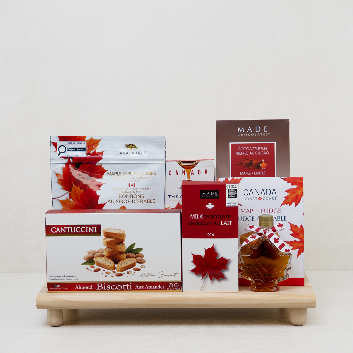 Canadian Maple Sweets Board with maple truffles, fudge, chocolate bar, candies, tea, syrup, and biscotti.