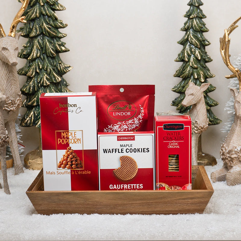 A festive Christmas gift basket with maple treats, Lindt chocolate and holiday cookies
