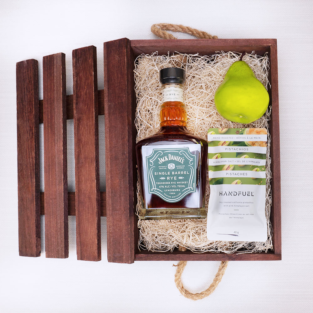 Whiskey & Pear Delight Crate with Jack Daniel's Single Barrel Rye, a green pear and Handfuel pistachios in wood wool