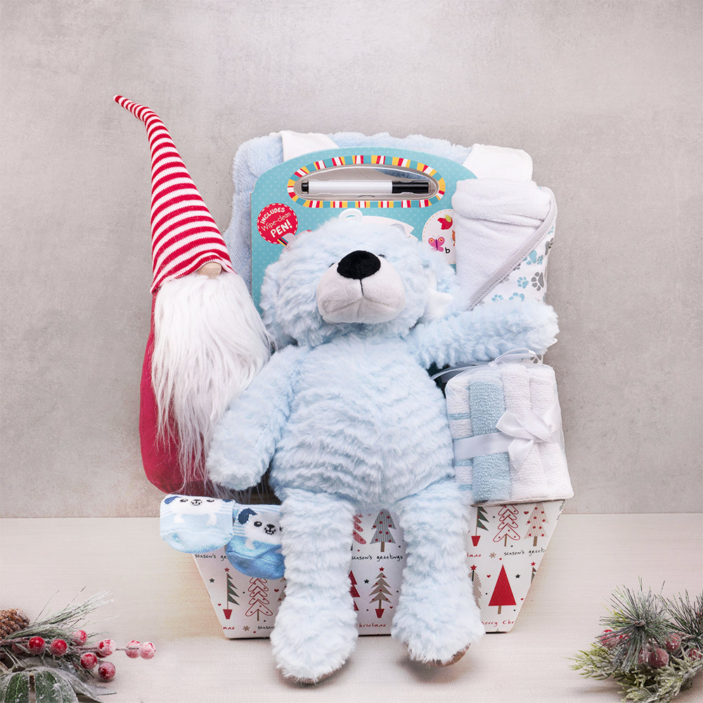 Winter Wonderland Baby Gift Basket with a fluffy blue plush, striped hat gnome, wipe-clean ABC book and blue washcloths