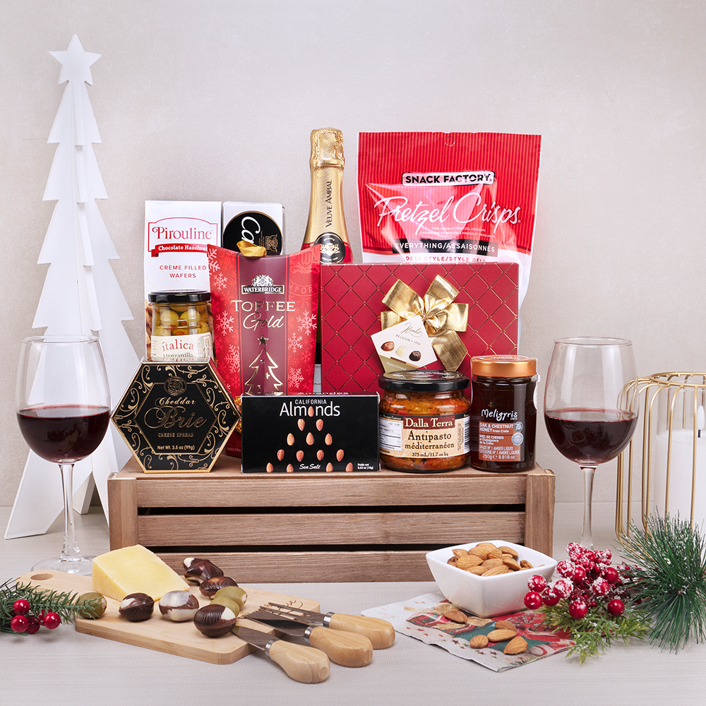 The Christmas Pantry Gift Basket with sparkling wine, toffees, antipasto, olives and cheese knives in a wooden crate