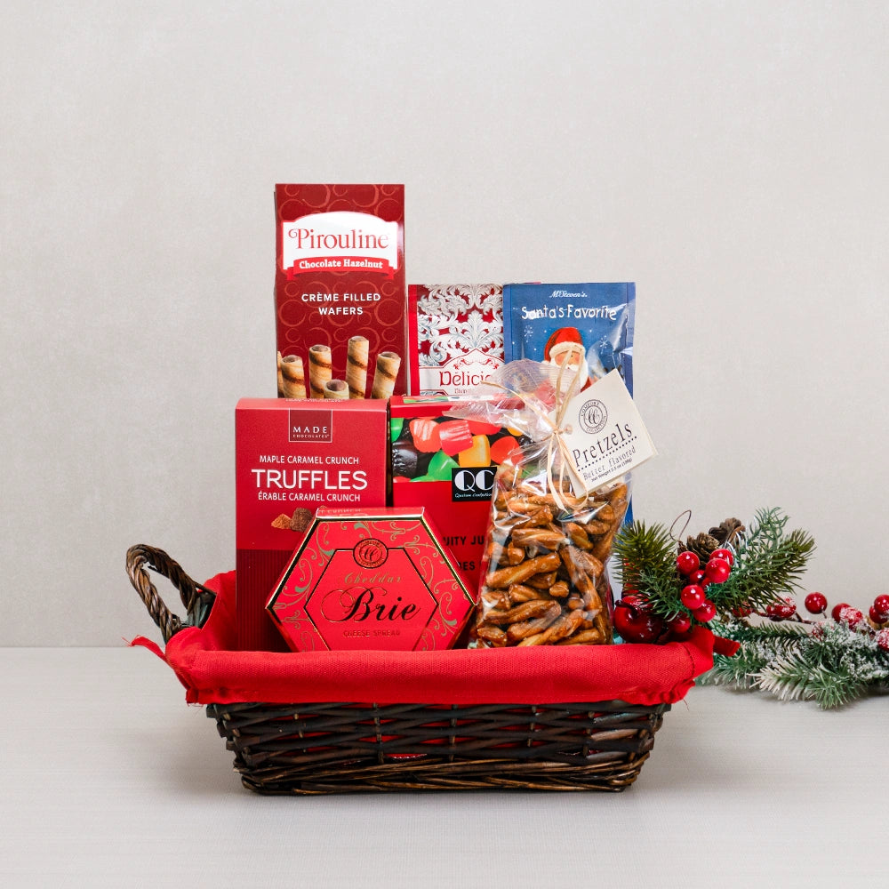 Sleigh Bells Gourmet Treats gift basket with Pirouline wafers, maple caramel truffles, Santa's Favorite cocoa and pretzels