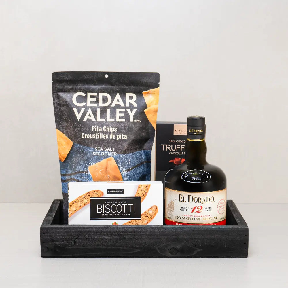 El Dorado Luxe Treats Basket: El Dorado 12 Year rum, Cedar Valley pita chips, dark truffles and biscotti on a black tray