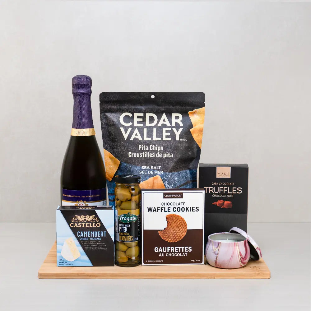 Cheers to Mom Gift Basket with sparkling wine, a marbled candle, Castello Camembert, Cedar Valley pita chips and truffles