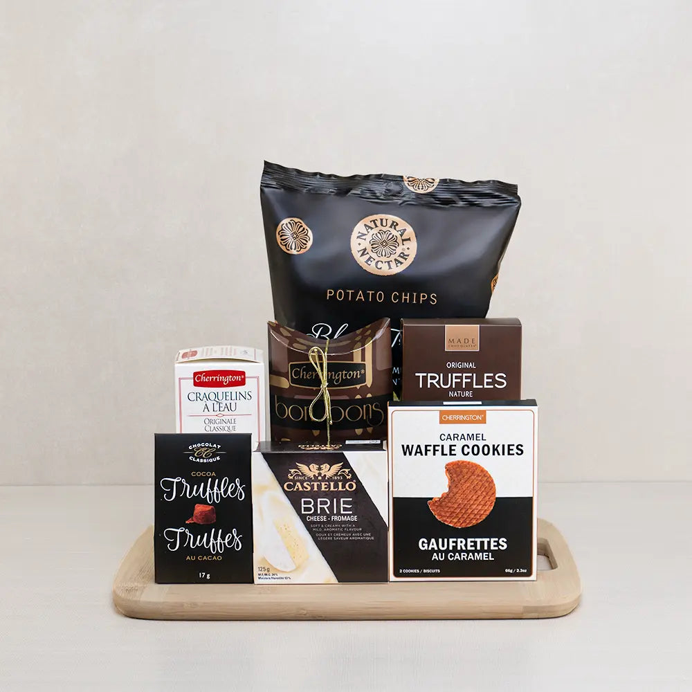Truffle & Brie Treat gift set with Natural Nectar truffle chips, Castello brie, MADE truffles and waffle cookies on bamboo
