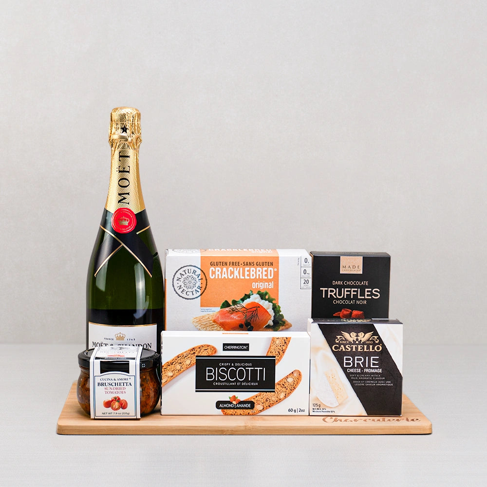 Moet Champagne & Artisan Delights gift set with Moët champagne, Castello brie, dark truffles and Cracklebred on a board