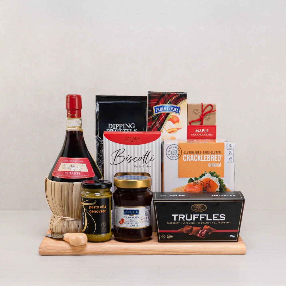 Old World Gourmet Elegance gift set with straw-wrapped Chianti, raspberry truffles, maple biscotti, pesto and a cheese knife