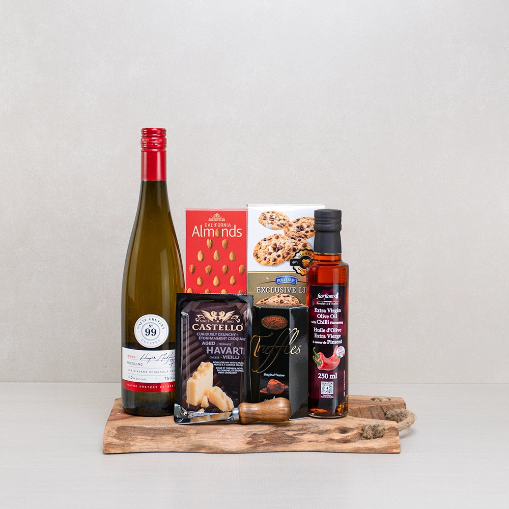 The Essence of Fine Taste gift set with Wayne Gretzky Riesling, Castello Havarti and chili olive oil on a live-edge board