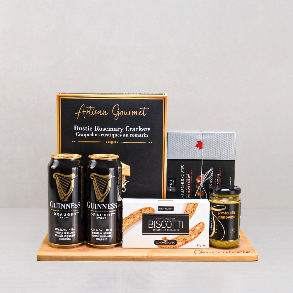 Guinness Beer Gift Set with two Guinness Draught cans, rosemary crackers, ice wine chocolates and almond biscotti on a board
