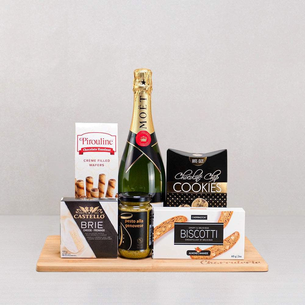 Golden Moments Champagne Basket with Moët Champagne, Castello brie, Pirouline wafers, biscotti and chocolate chip cookies
