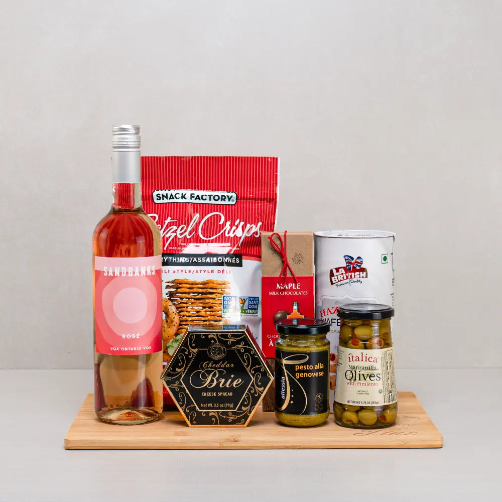 Cheese & Rose Celebration gift set with Sandbanks rosé, cheddar brie spread, Manzanilla olives, pesto and pretzel crisps