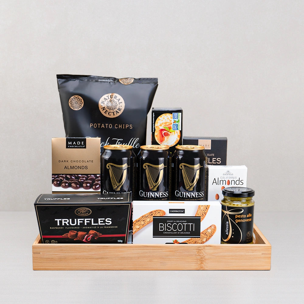 Guinness Beer, Pesto & Truffle Set: three Guinness cans, black truffle chips, raspberry truffles and almonds in a bamboo tray