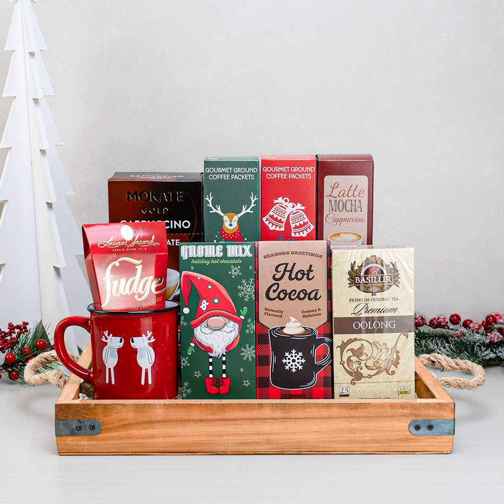 Holiday Coffee & Tea Collection with a red reindeer mug, Laura Secord fudge, oolong tea, hot cocoa and cappuccino on a tray