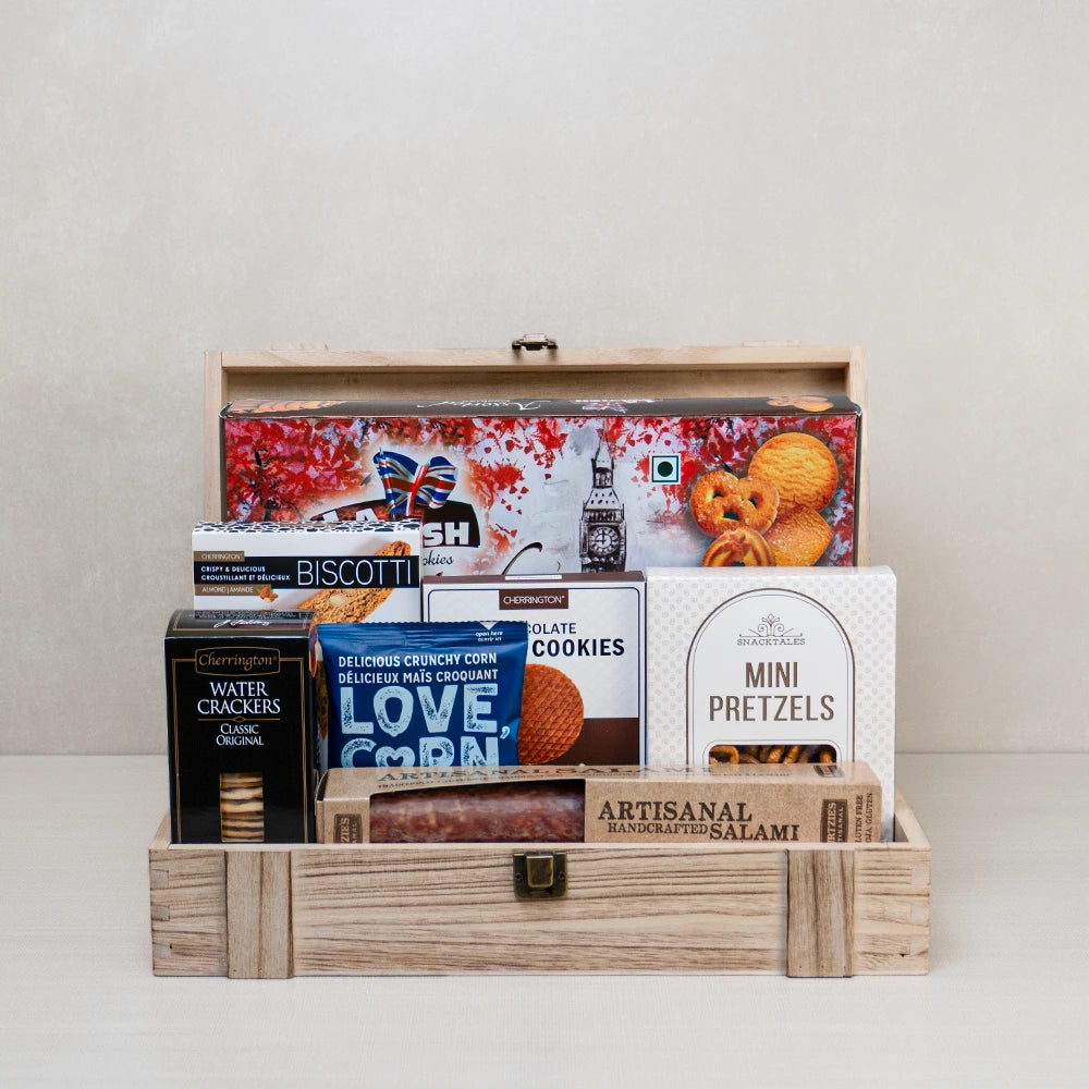 Perfect Pairings Wooden Box with mini pretzels, crackers, almond biscotti, salami, cookies, and corn snacks in a wooden box.