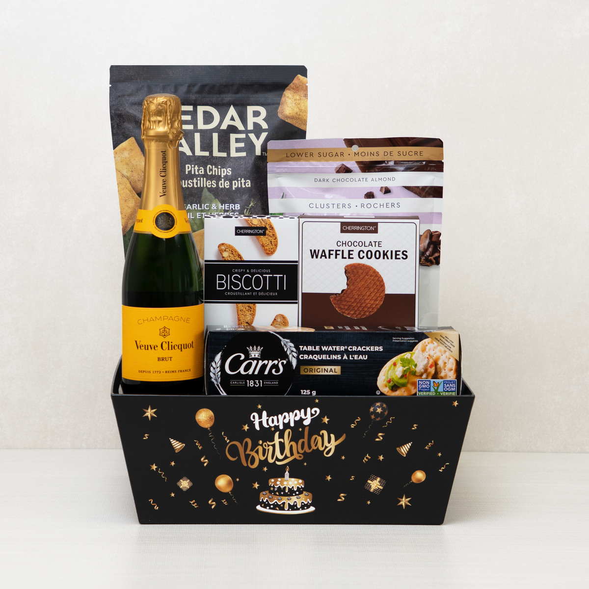 Pop the Bubbly Birthday Basket with Veuve Clicquot Brut, garlic pita chips, chocolate almond clusters and waffle cookies