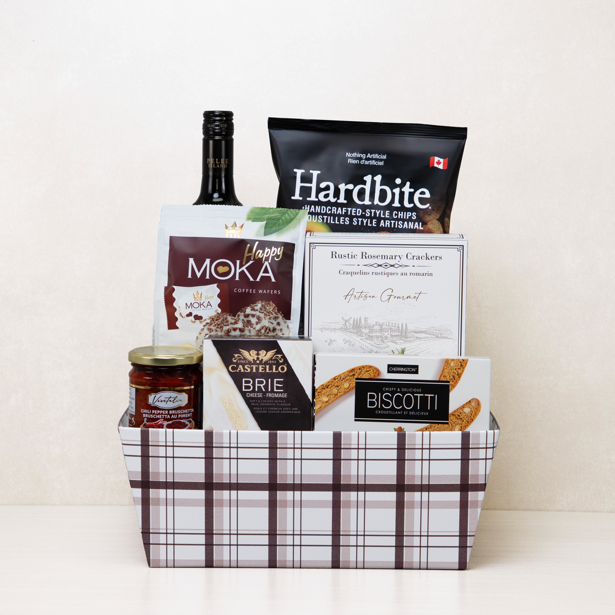 Prestige Corporate Basket with red wine, brie cheese, chips, crackers, pesto, and more.