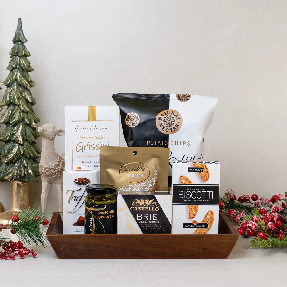 Season's Savoury Basket with chips, biscotti, breadsticks, cheese, chocolates, biscotti, and pesto for Christmas and New Year's.