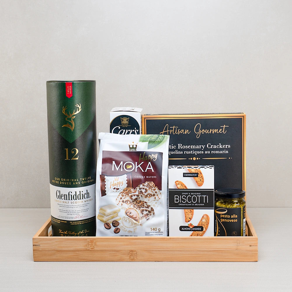 Twelve-Year Toast Basket with Glenfiddich 12 single malt Scotch, Moka coffee wafers, rosemary crackers and pesto on bamboo