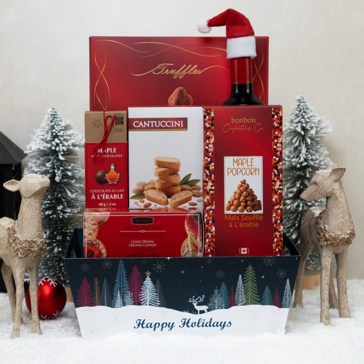 Wine & Delights gift basket with red wine, popcorn, crackers, biscotti, and truffles.