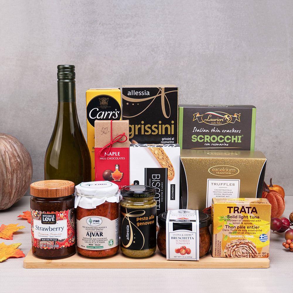 European Flavors Gourmet Gift Set with white wine, Trata smoked tuna, ajvar, bruschetta and cocoa truffles on a bamboo board