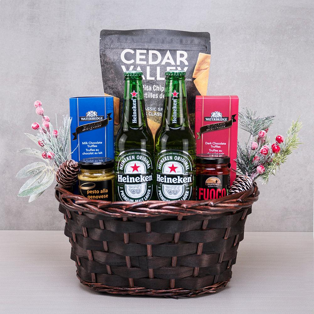 Holly & Ivy Christmas Basket with two Heineken bottles, Waterbridge Belgian truffles, Cedar Valley pita chips and pesto