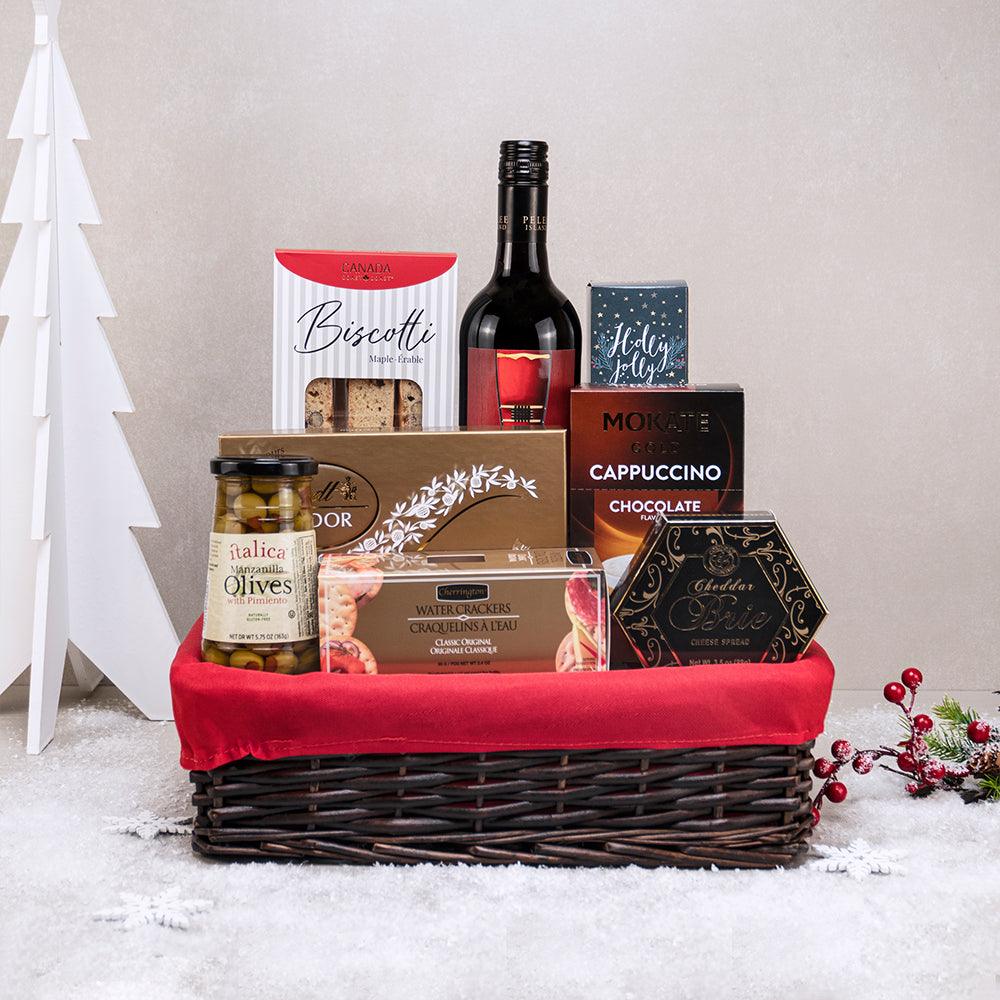 Noel Nights Gourmet Basket: red wine, Lindt Lindor, maple biscotti, chocolate cappuccino and olives in red-lined wicker