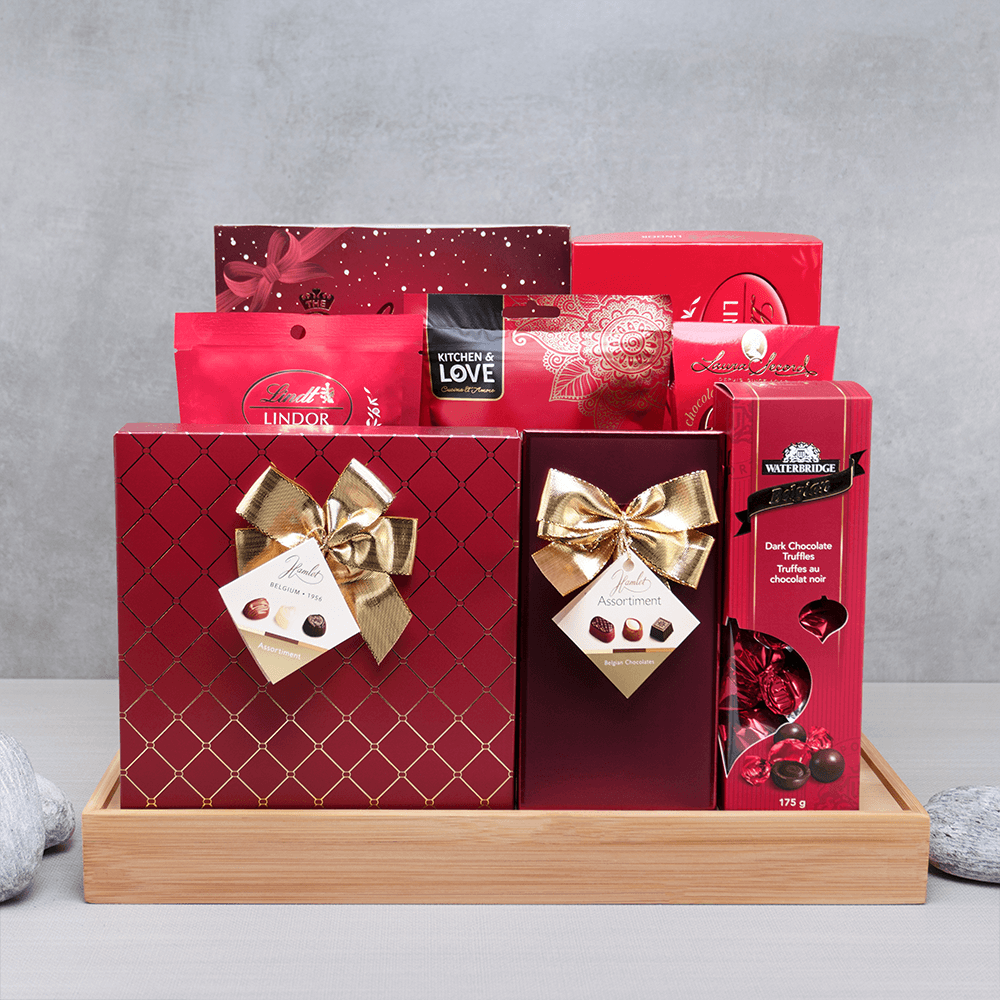 Pure Chocolate Bliss Gift Hamper with gold-bowed Hamlet chocolates, Lindt Lindor and Waterbridge truffles on a bamboo tray