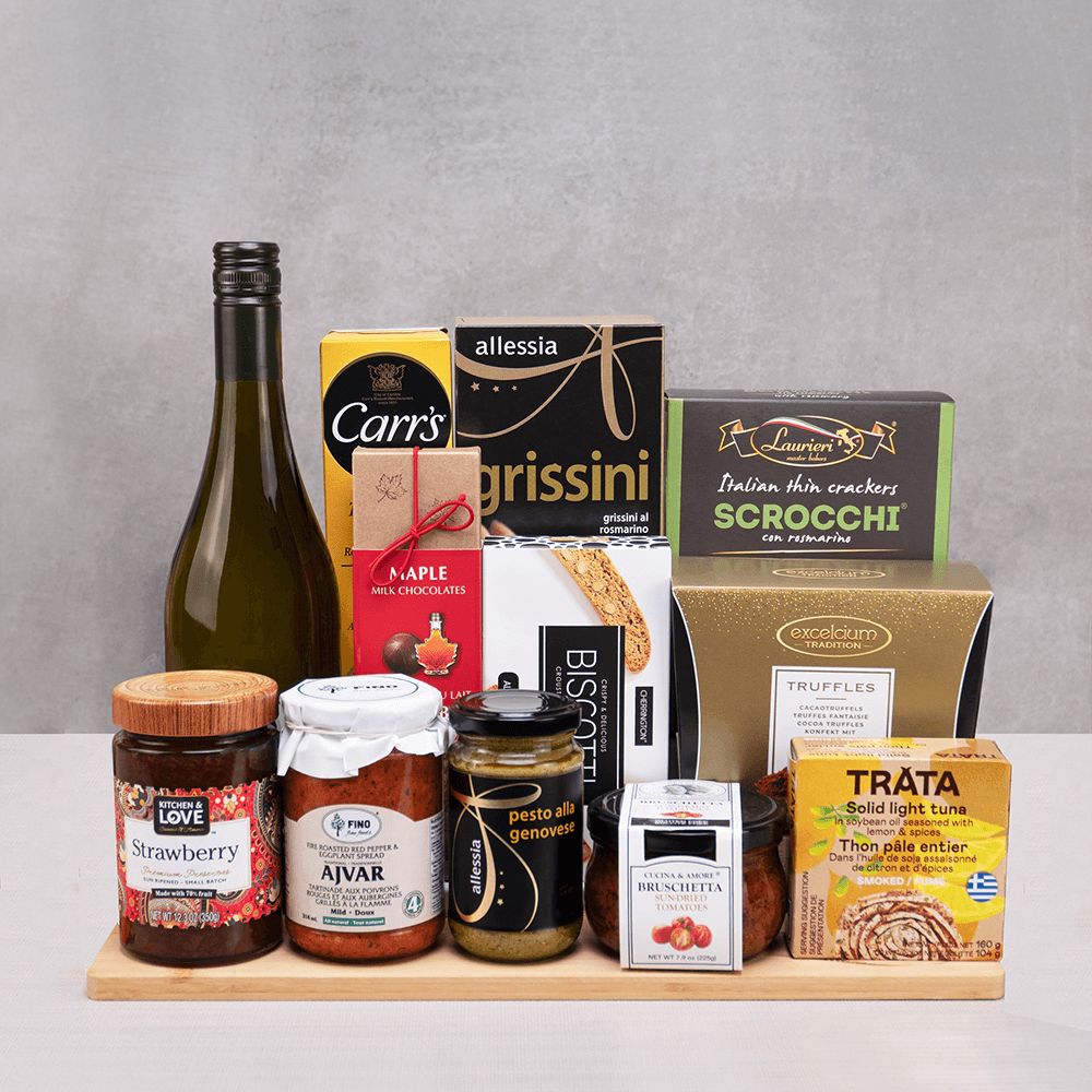 Royal Reserve Gourmet Basket on a bamboo board: white wine, Excelcium truffles, grissini, Scrocchi crackers and Trata tuna