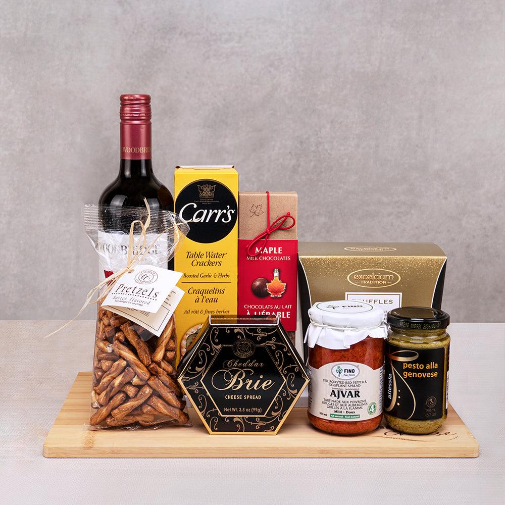 The Executive Appreciation Crate with Woodbridge red wine, Cheddar Brie spread, Carr's crackers and ajvar on a bamboo board